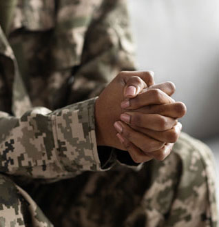 AA-woman with hands clasped in prayer